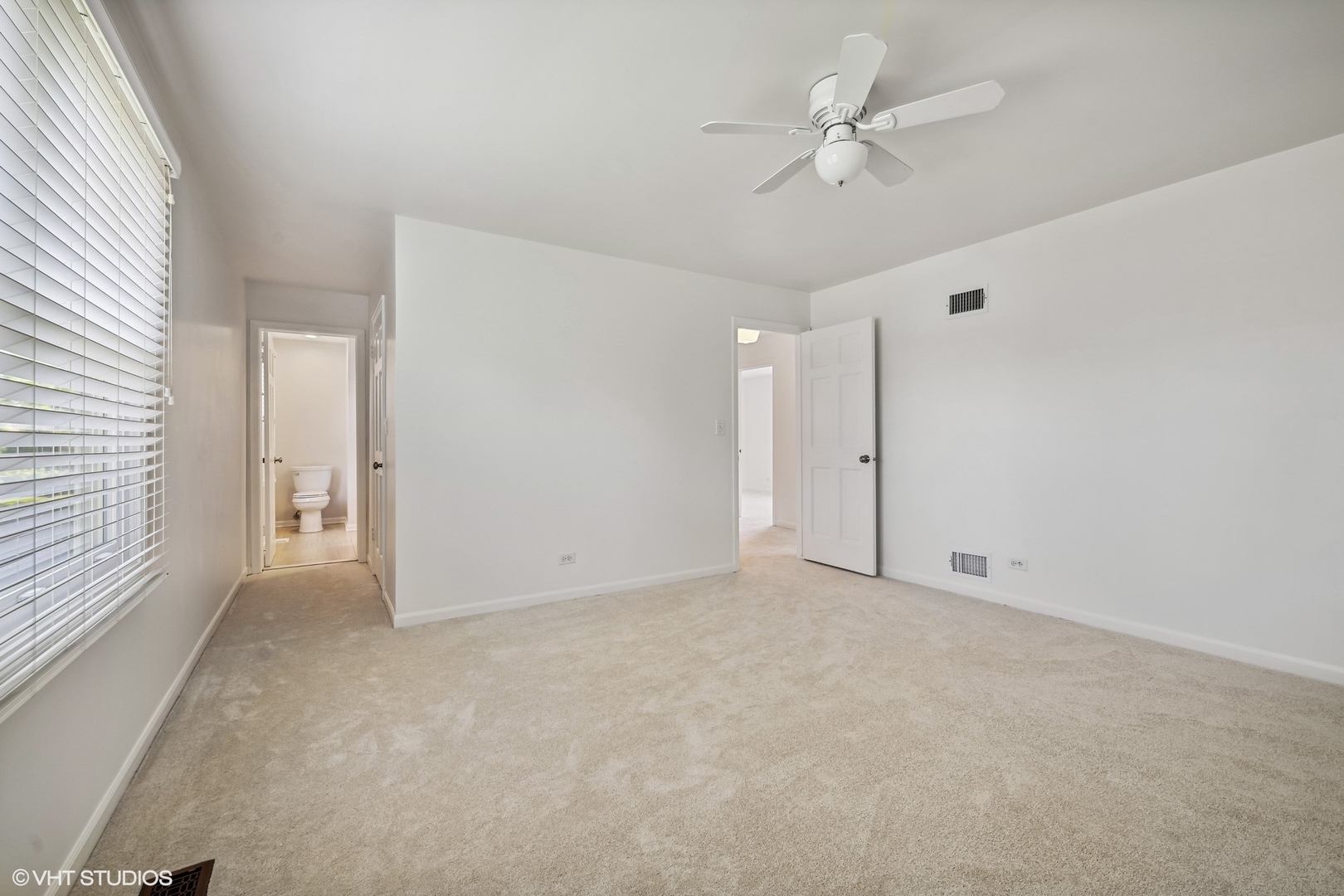 4130 Rutgers Lane Northbrook, IL 60062 - Photo 30 of 41 an empty room with fan and windows