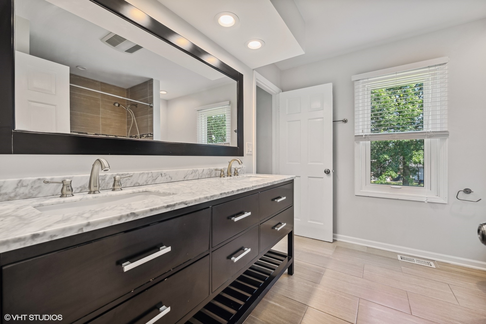 4130 Rutgers Lane Northbrook, IL 60062 - Photo 31 of 41 a bathroom with a granite countertop sink and a mirror
