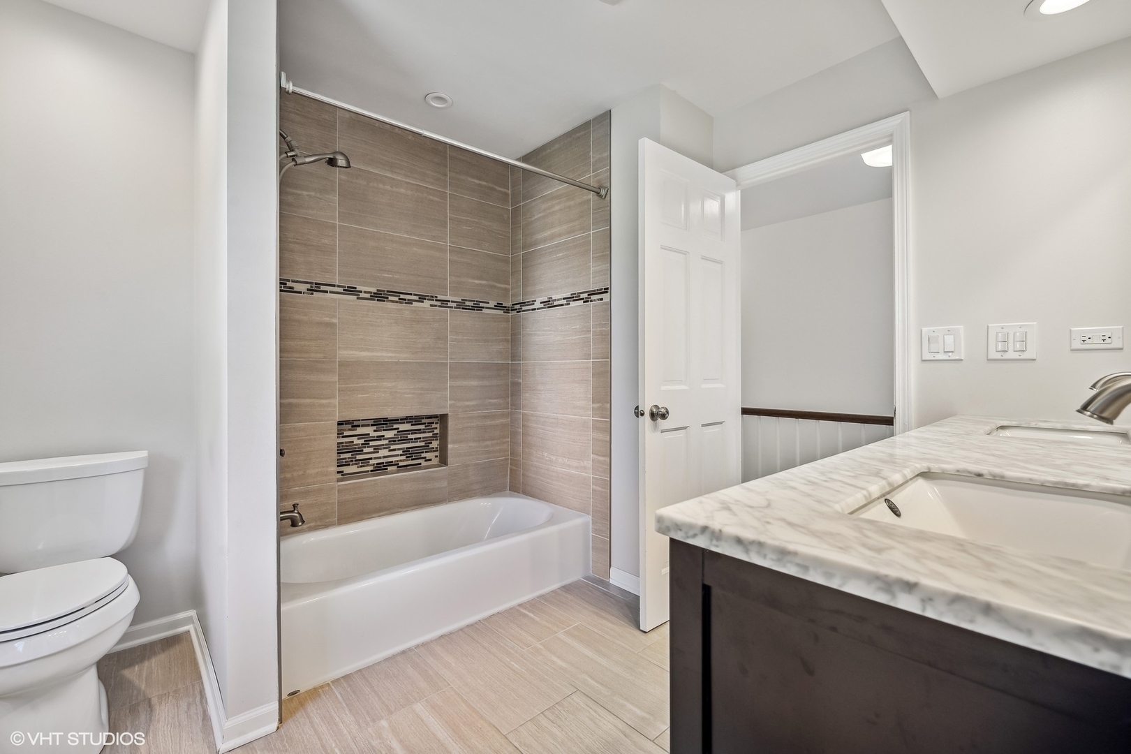 4130 Rutgers Lane Northbrook, IL 60062 - Photo 32 of 41 a bathroom with a granite countertop sink a toilet and shower