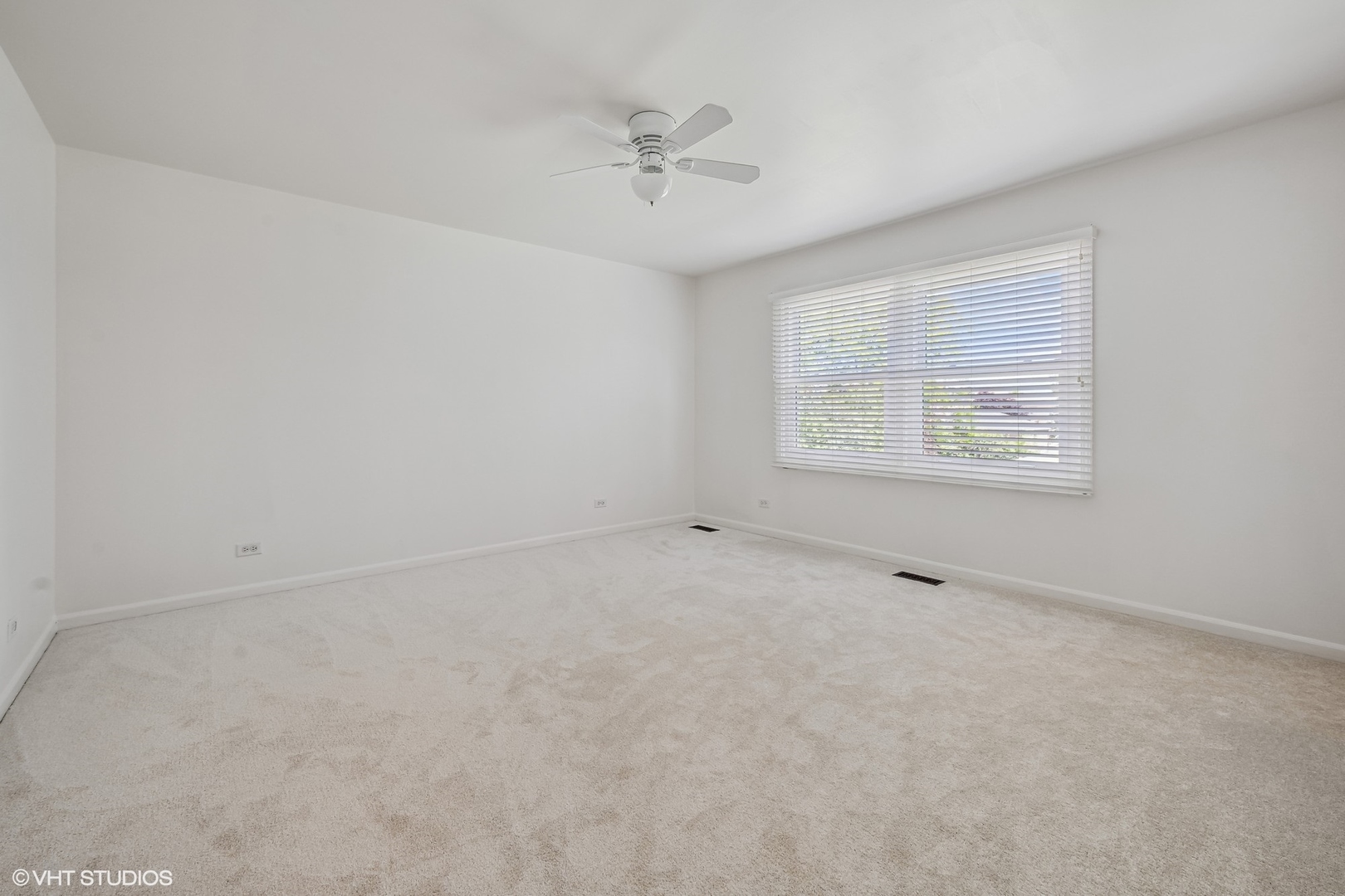 4130 Rutgers Lane Northbrook, IL 60062 - Photo 33 of 41 an empty room with a window and a ceiling fan