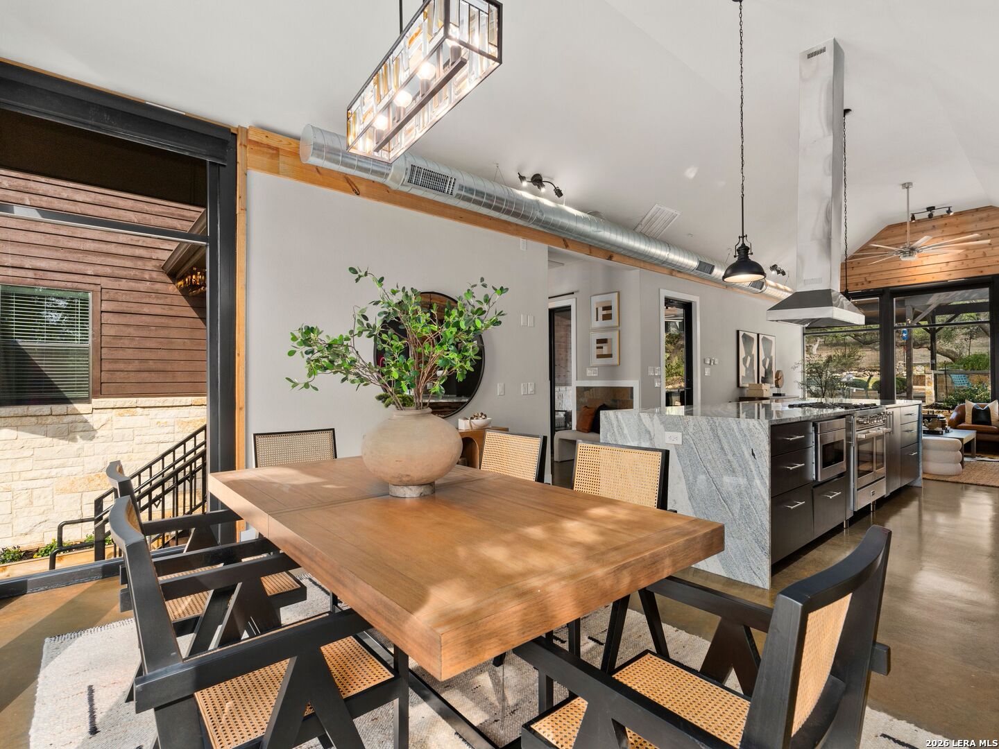 1146 Victoria Avenue Spring Branch, TX 78070 - Photo 17 of 89 a view of a dining room with furniture and wooden floor
