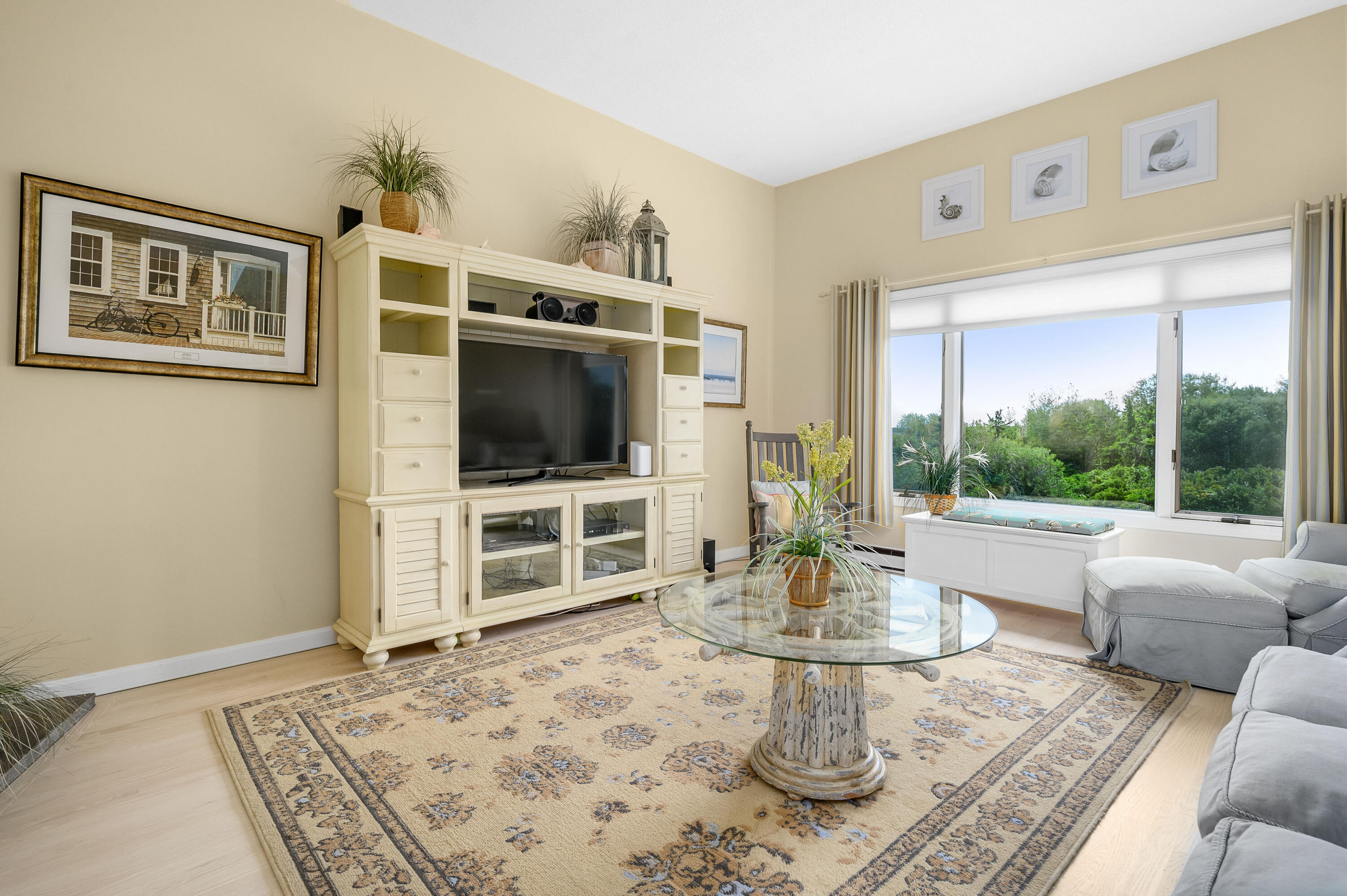 500 Ocean Street, Unit 68 Hyannis, MA 02601 - Photo 12 of 39 a living room with furniture and a flat screen tv