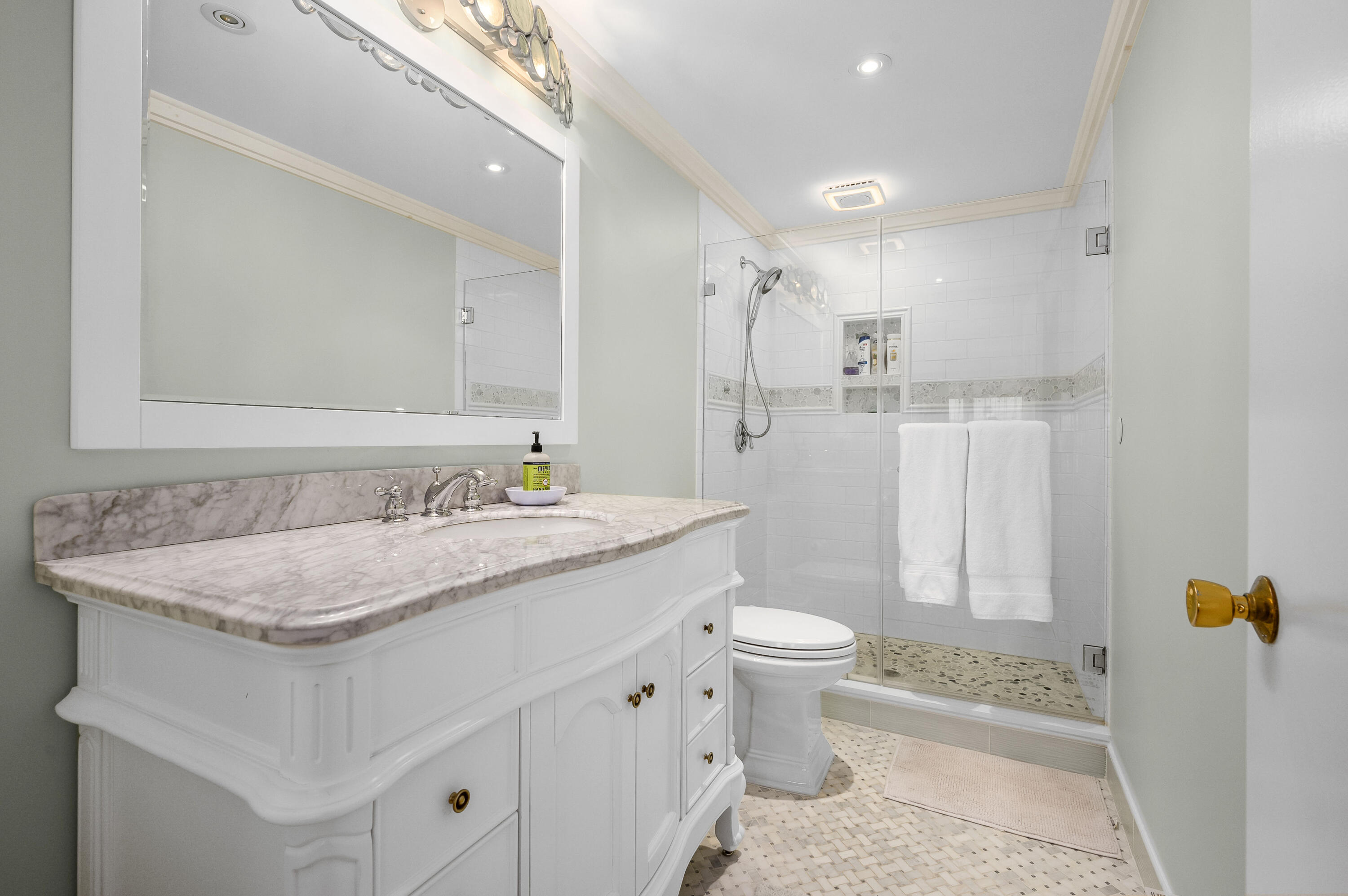 500 Ocean Street, Unit 68 Hyannis, MA 02601 - Photo 16 of 39 a bathroom with a granite countertop sink toilet and shower