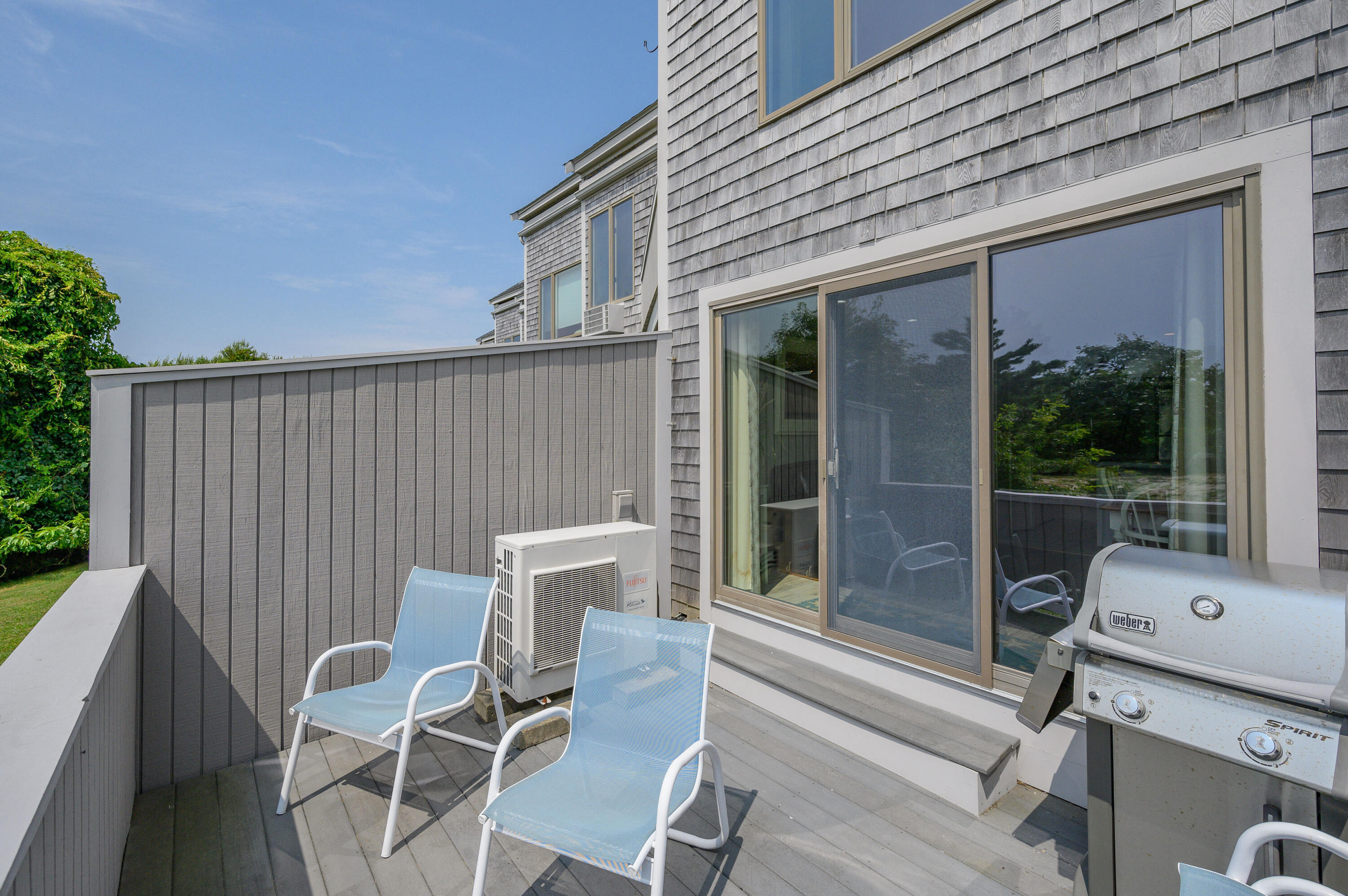 500 Ocean Street, Unit 68 Hyannis, MA 02601 - Photo 29 of 39 a view of a patio with a table and chairs
