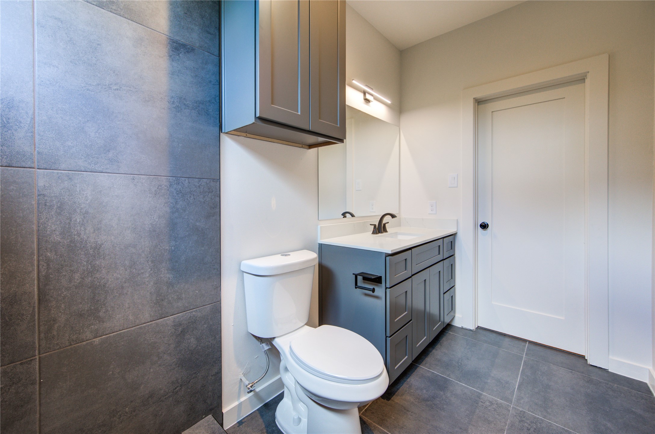 13115 Wild Orchid Lane Cypress, TX 77429 - Photo 26 of 48 a bathroom with a sink toilet and mirror