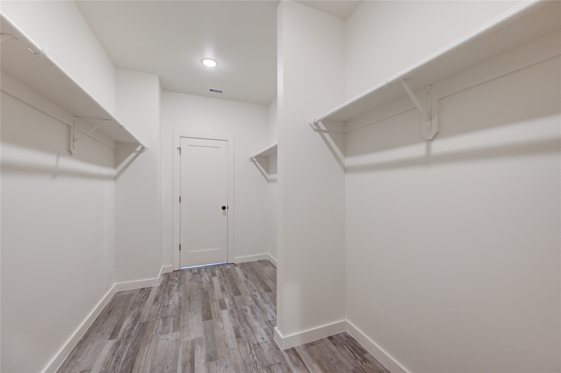 13115 Wild Orchid Lane Cypress, TX 77429 - Photo 28 of 48 a view of small space with racks on the wall