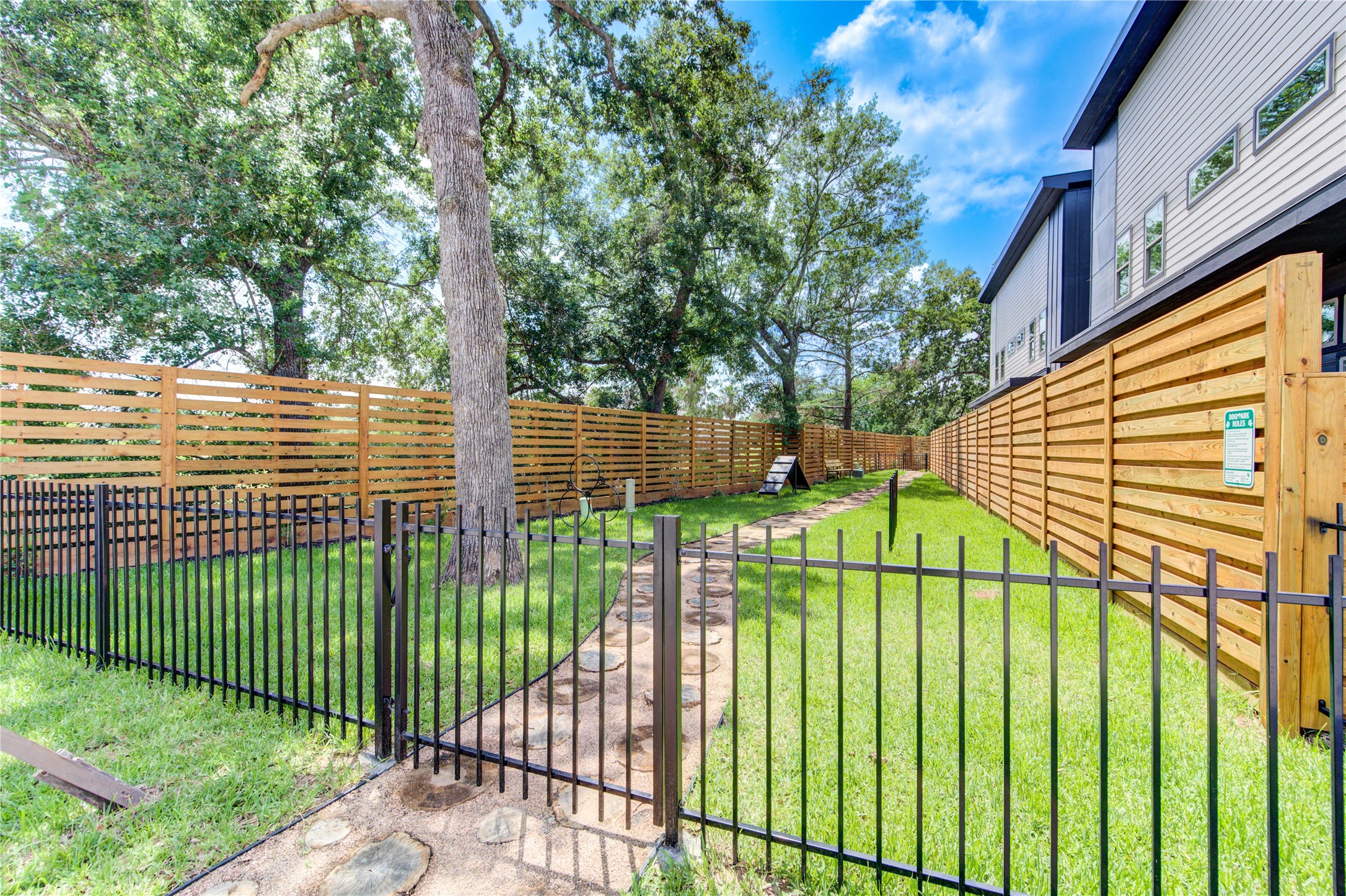 13115 Wild Orchid Lane Cypress, TX 77429 - Photo 35 of 48 a view of a wrought iron fences in front of a yard