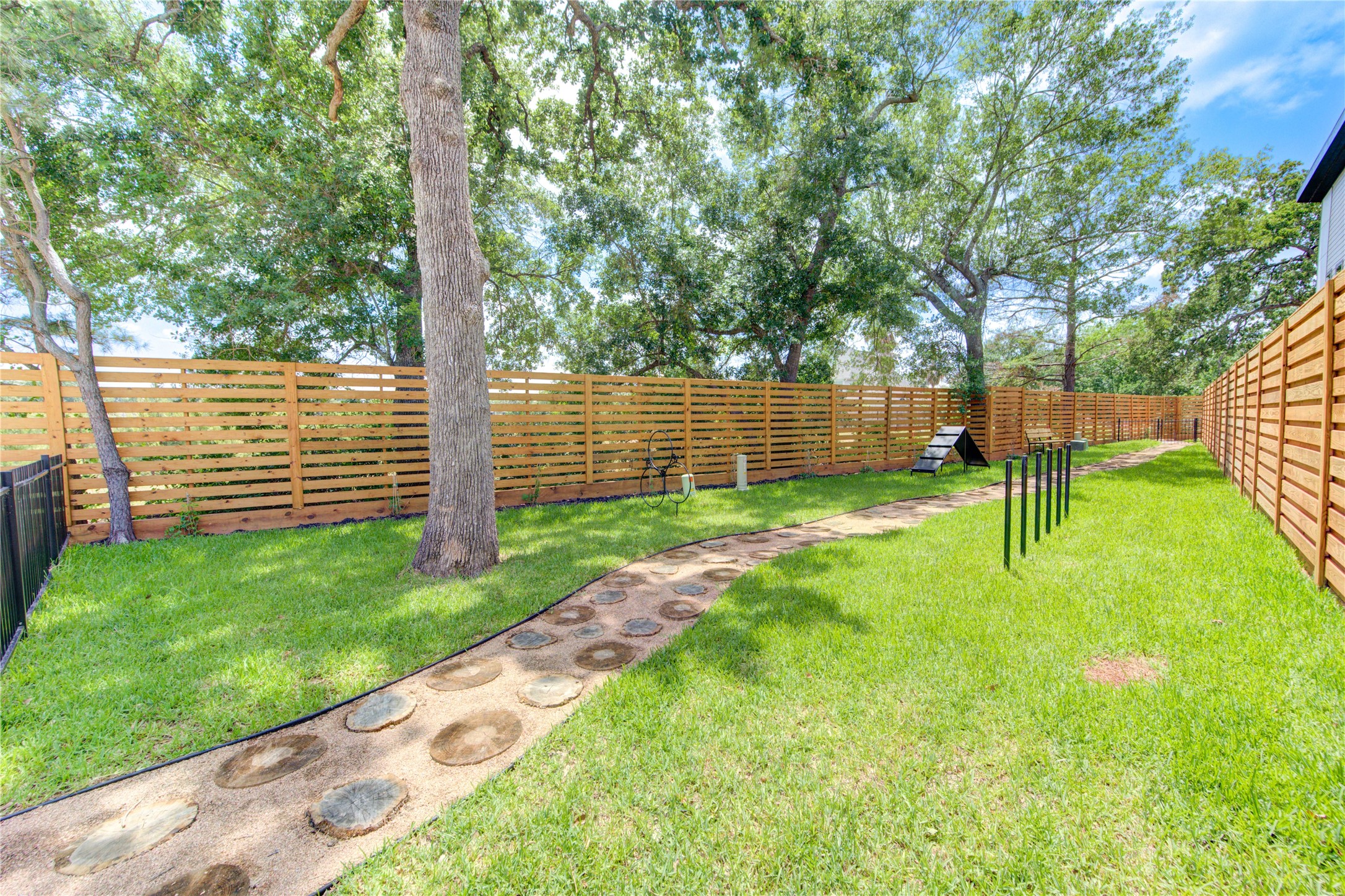 13115 Wild Orchid Lane Cypress, TX 77429 - Photo 36 of 48 a view of a backyard with a slide