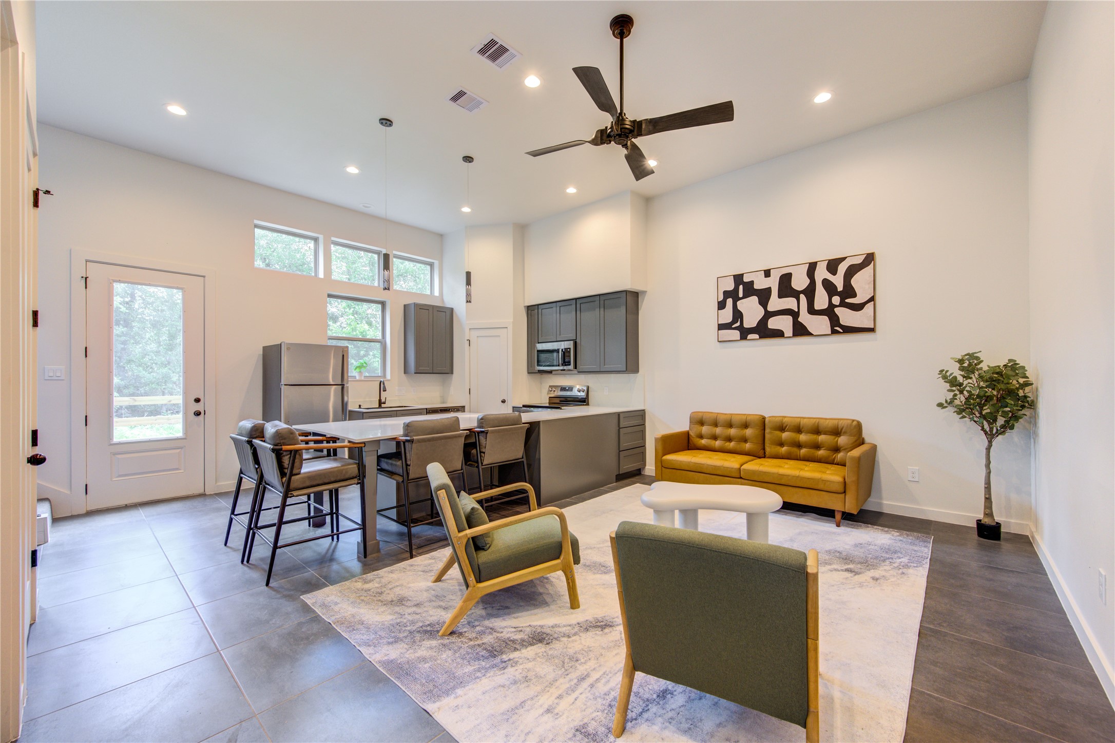 13115 Wild Orchid Lane Cypress, TX 77429 - Photo 5 of 48 a living room with furniture a chandelier and a flat screen tv