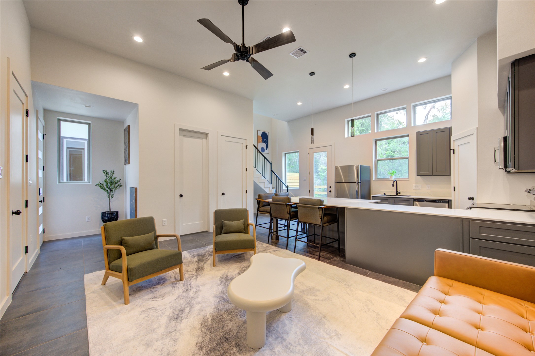 13115 Wild Orchid Lane Cypress, TX 77429 - Photo 6 of 48 a living room with furniture a flat screen tv and a large window