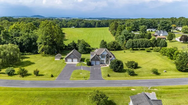 an aerial view of a house with a garden