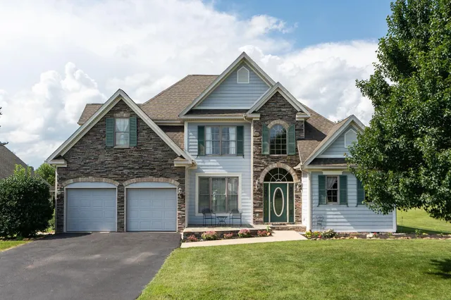 front view of a house with a yard