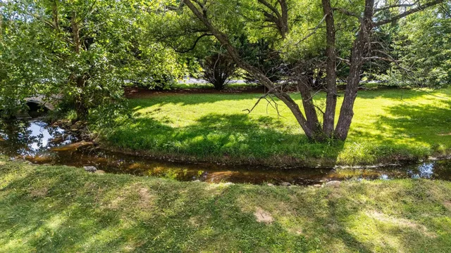 a view of swimming pool with a yard