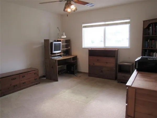 a workspace with furniture and window