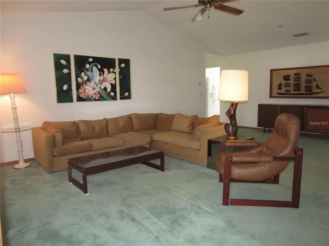 a living room with furniture and a window