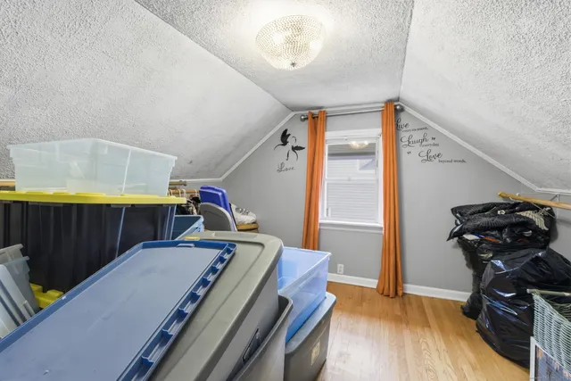 a bedroom with furniture and a window