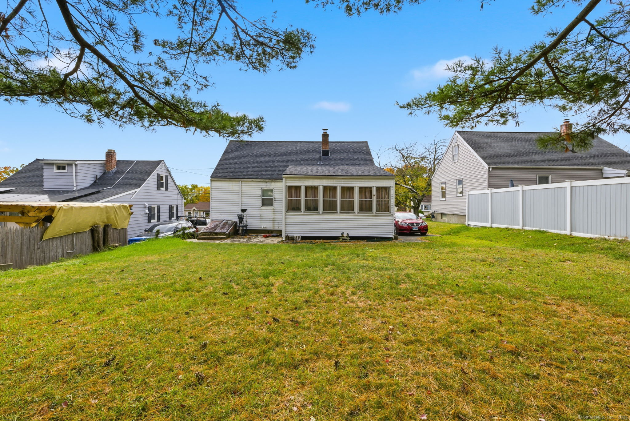 55 Alexander Road New Britain, CT 06053 - Photo 29 of 38 a front view of a house with a yard table and chairs