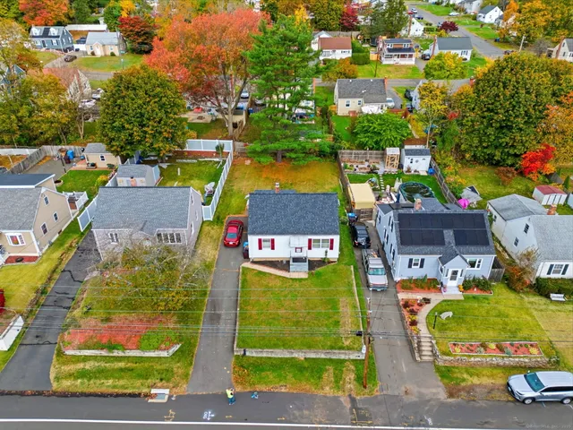 an aerial view of residential house with outdoor space and swimming pool