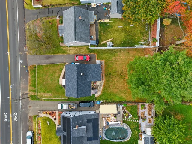 an aerial view of residential house with outdoor space and street view