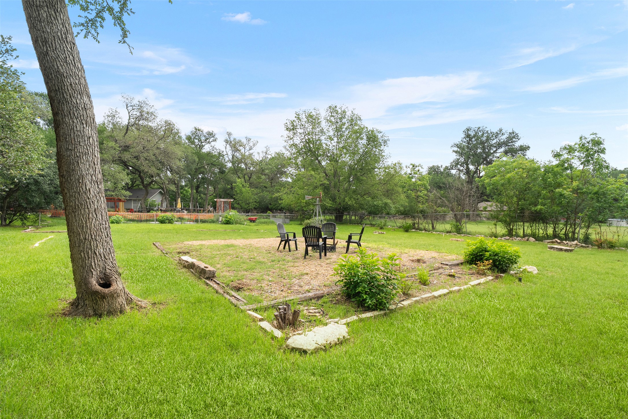 303 West Sequoia Spur Georgetown, TX 78628 - Photo 27 of 34 a view of a backyard with large trees