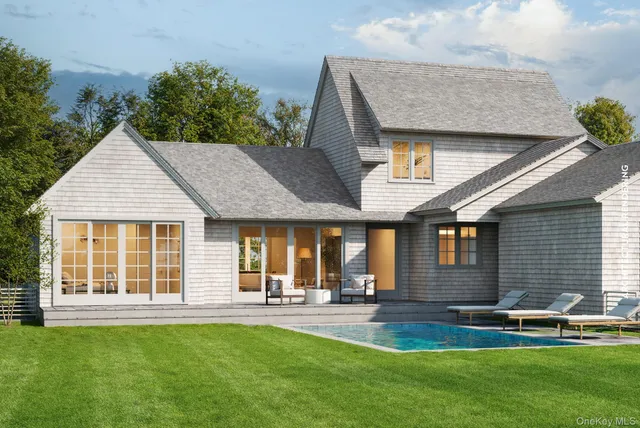 a aerial view of a house with swimming pool yard and patio