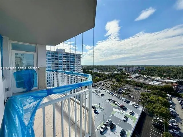 a view of a chairs and table in the balcony