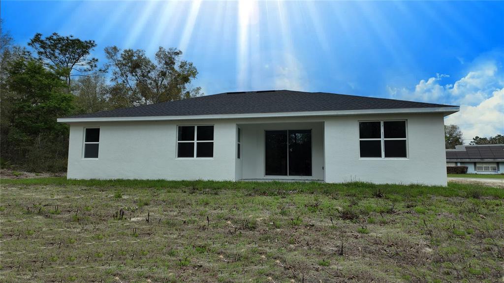 7 Spring Pass Ocala, FL 34472 - Photo 8 of 35 a house with trees in the background
