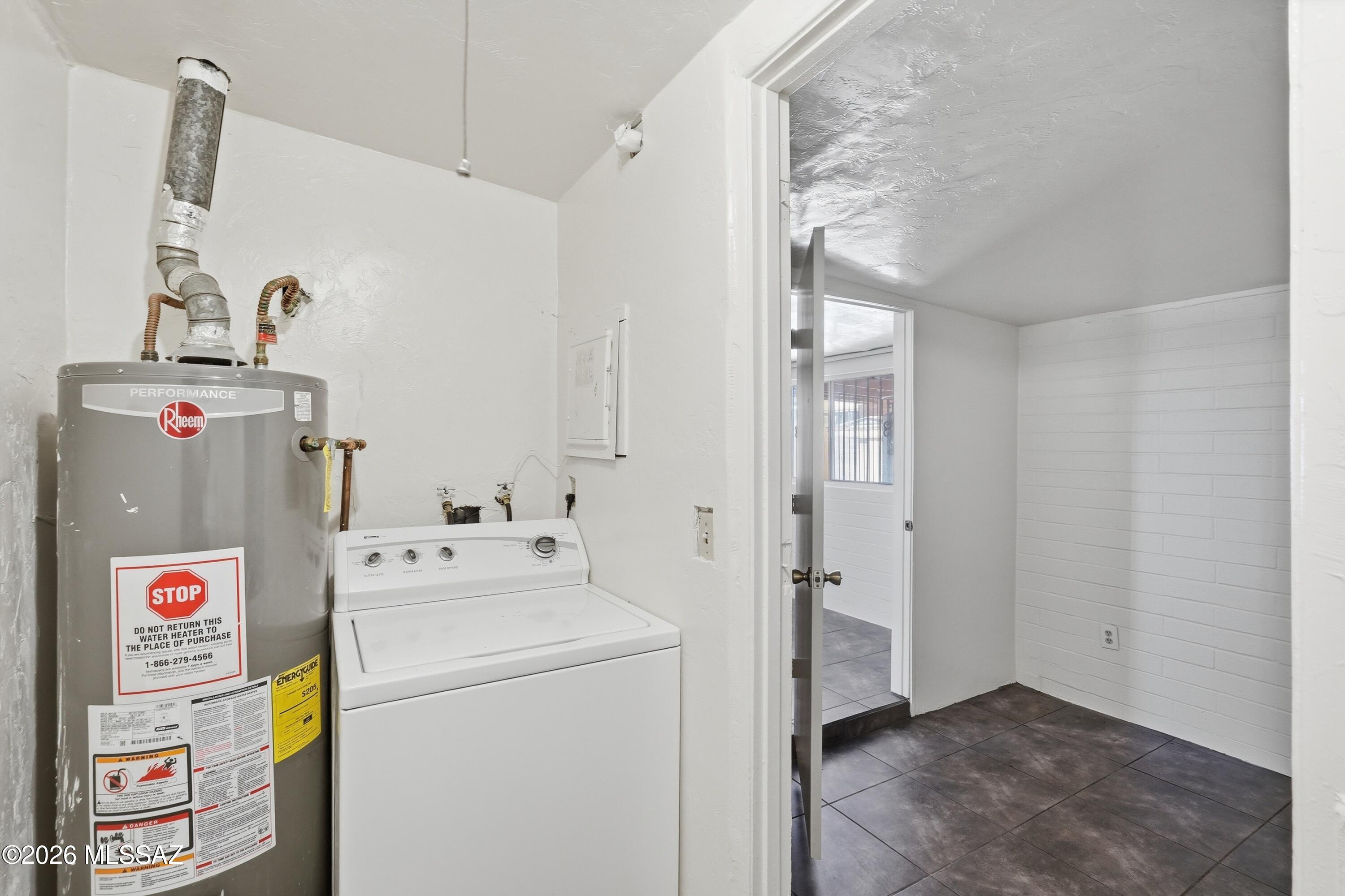 1808 West Caravelle Road Tucson, AZ 85713 - Photo 32 of 38 a utility room with dryer and washer
