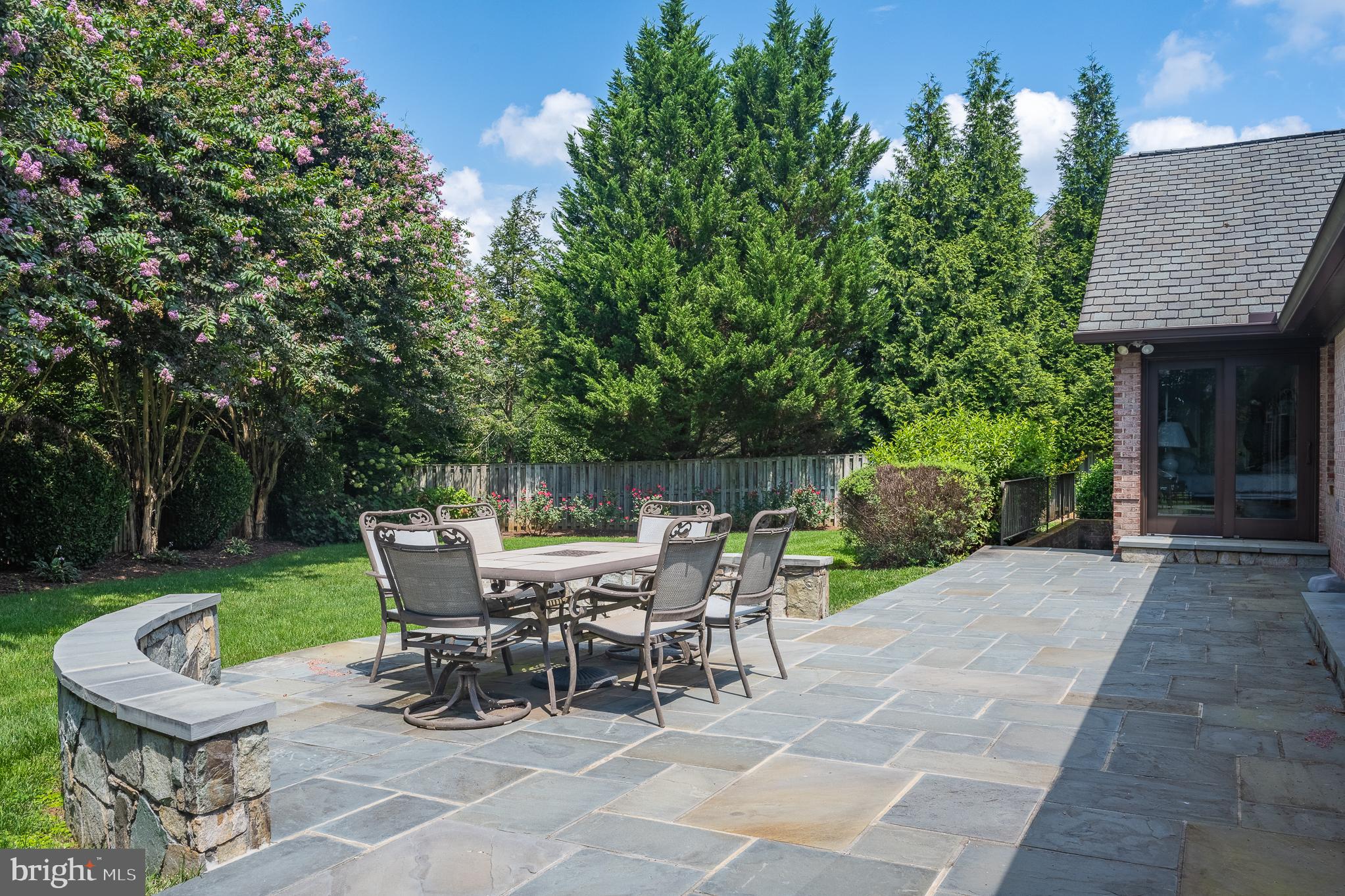 11301 Crossing Glen Court Potomac, MD 20854 - Photo 131 of 136 a view of a patio with table and chairs and potted plants