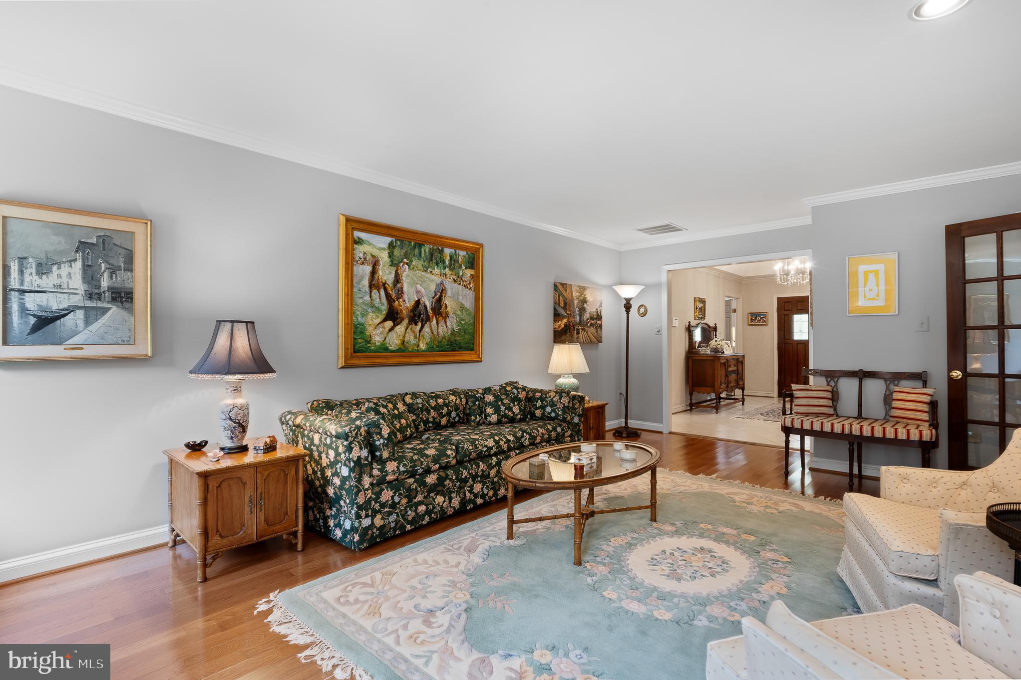 11301 Crossing Glen Court Potomac, MD 20854 - Photo 21 of 136 a living room with furniture and a rug