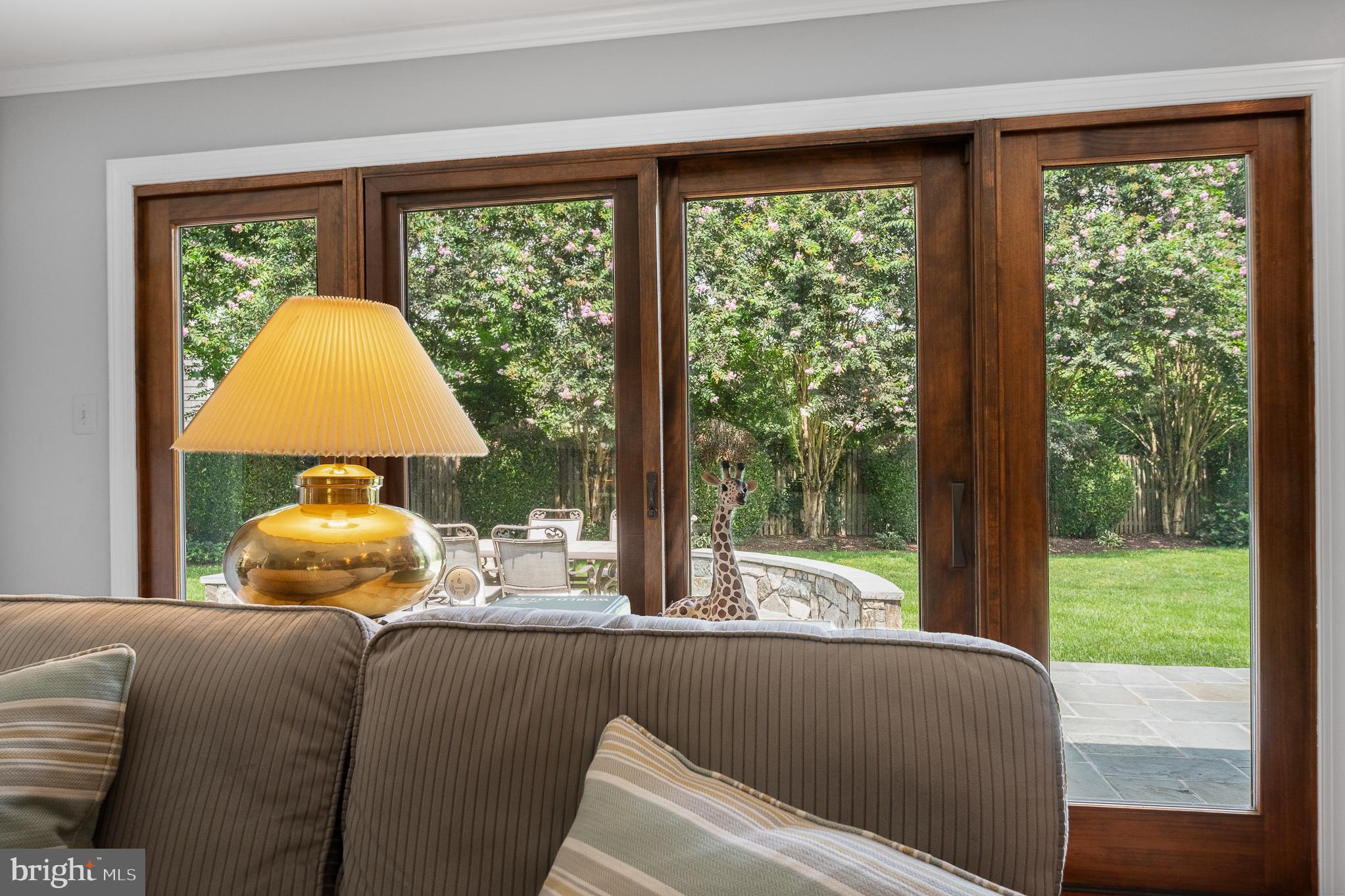 11301 Crossing Glen Court Potomac, MD 20854 - Photo 27 of 136 a living room with a large window and a table