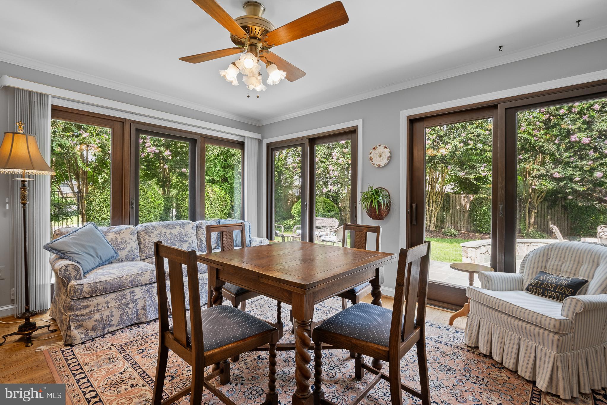 11301 Crossing Glen Court Potomac, MD 20854 - Photo 28 of 136 a view of a dining room with furniture large windows and wooden floor