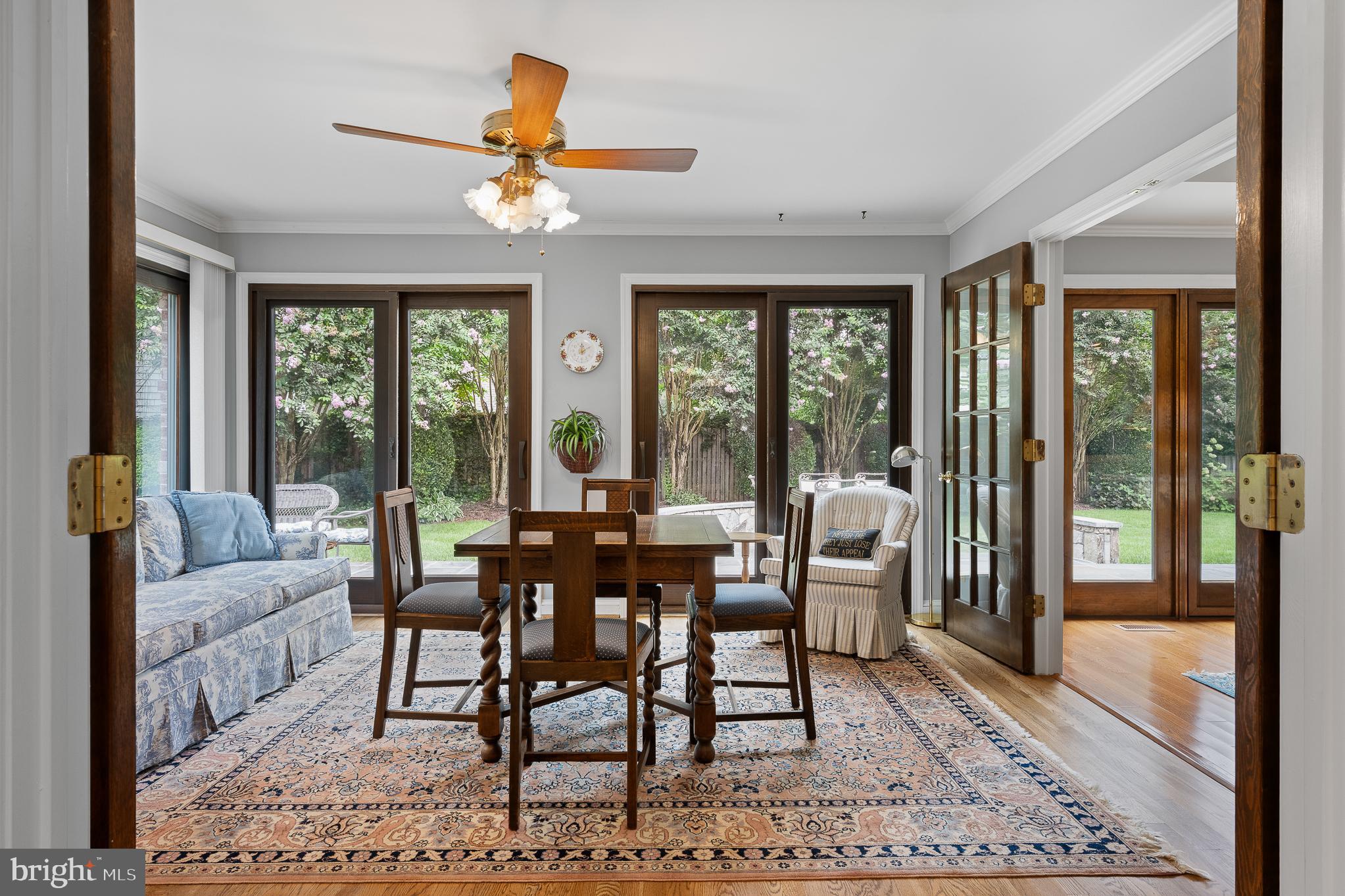 11301 Crossing Glen Court Potomac, MD 20854 - Photo 32 of 136 a dining room with furniture large windows and wooden floor
