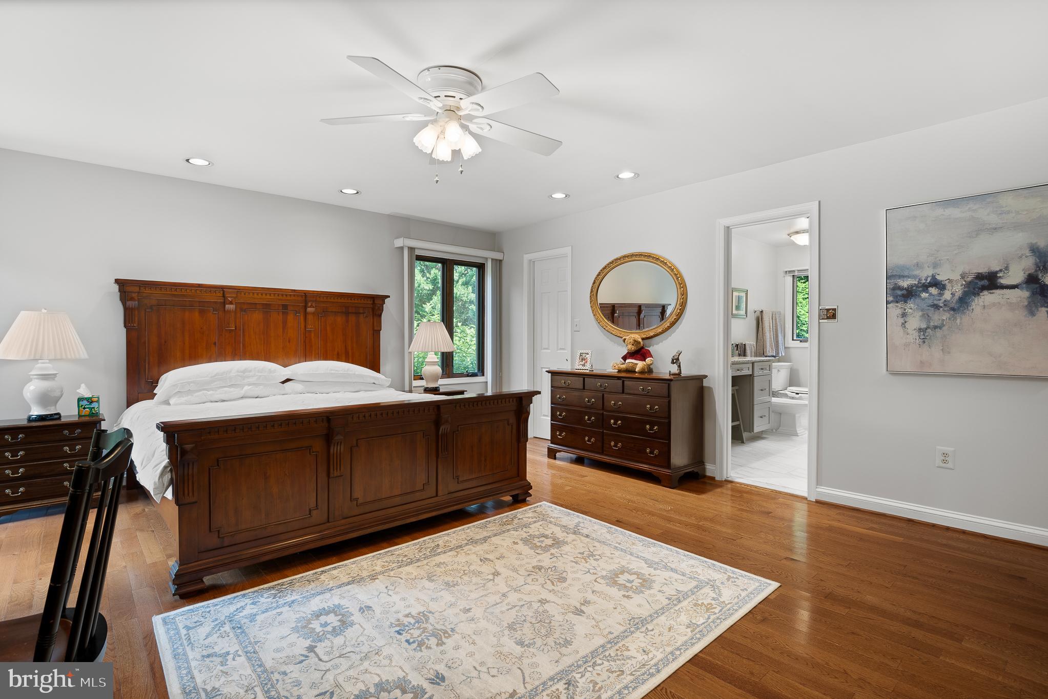 11301 Crossing Glen Court Potomac, MD 20854 - Photo 71 of 136 a living room with a couch and a dresser with wooden floor