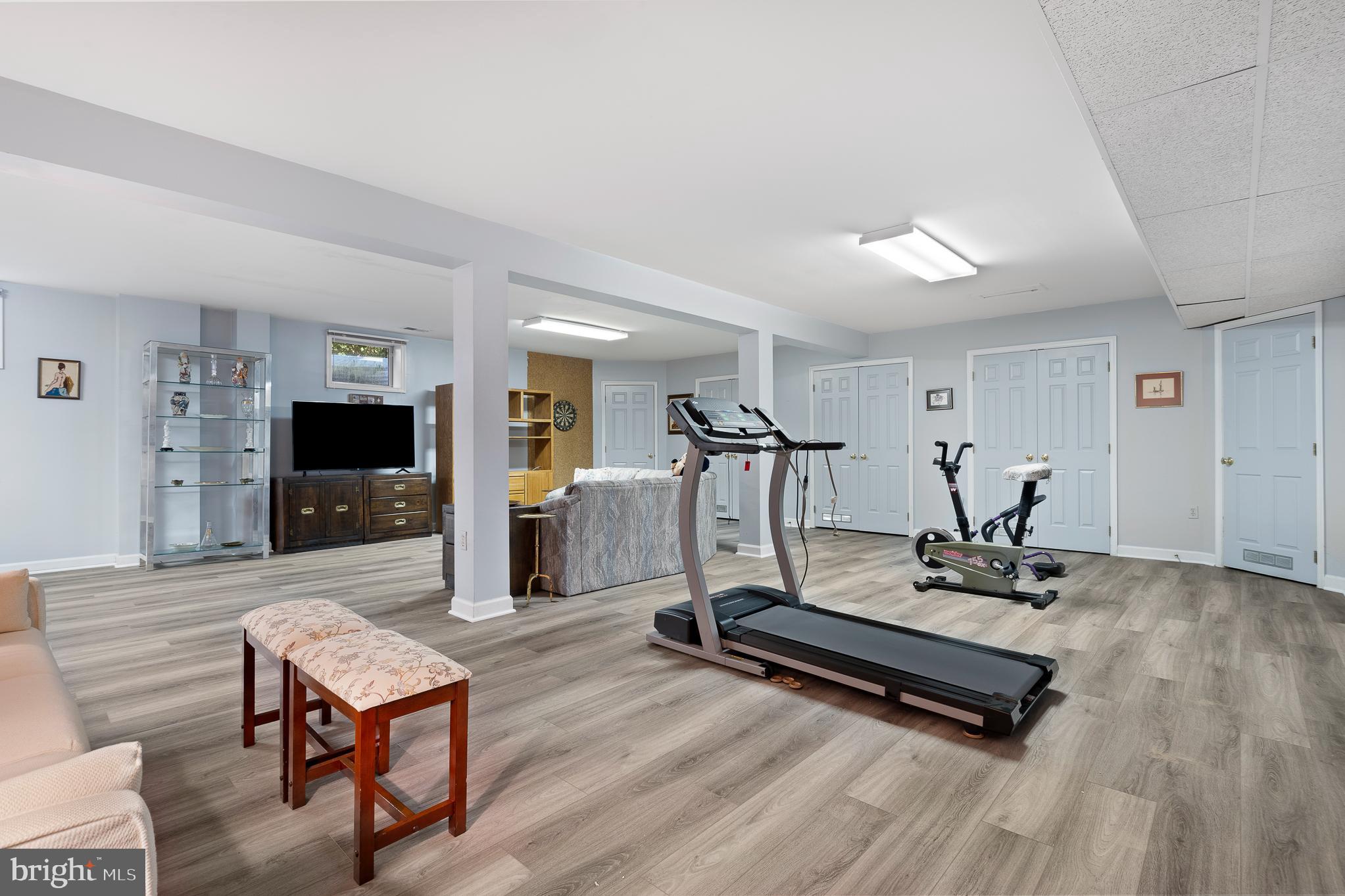 11301 Crossing Glen Court Potomac, MD 20854 - Photo 93 of 136 a living room with furniture pool table flat screen tv and windows