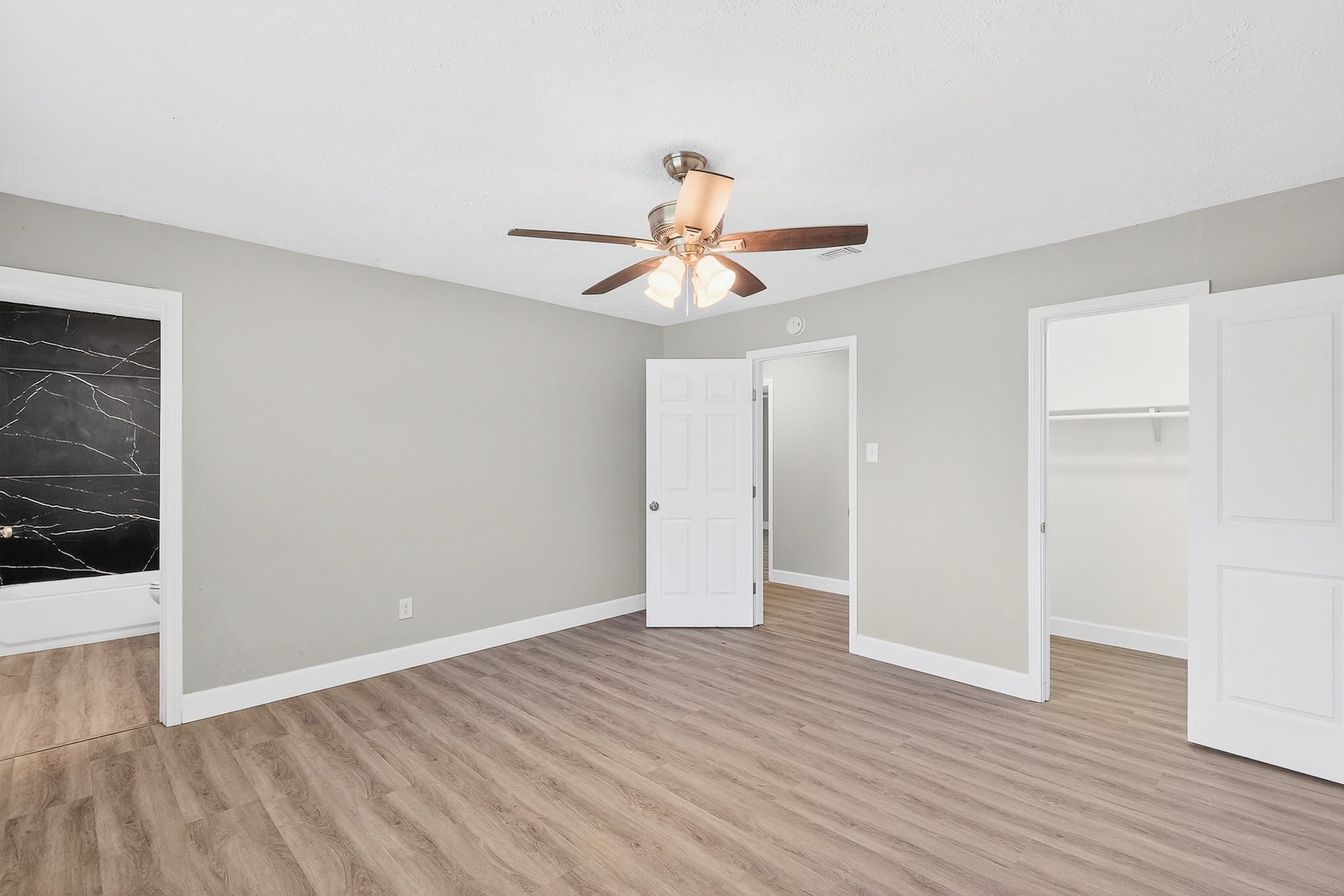 2510 Marble Falls Drive Spring, TX 77373 - Photo 13 of 26 a view of a room with wooden floor and a ceiling fan