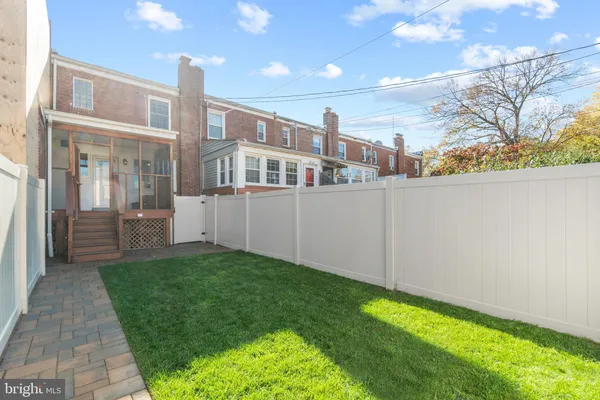 a view of a back yard of the house