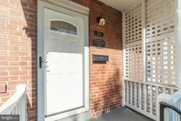 a view of a door and brick wall