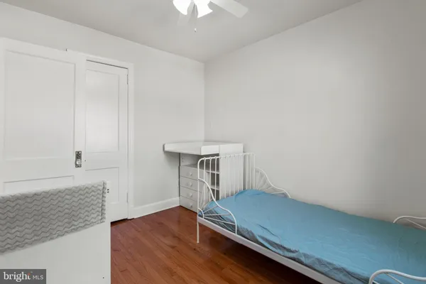 an empty room with wooden floor