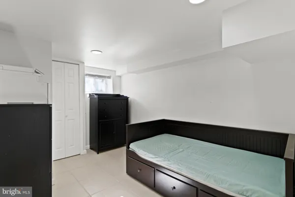 a bedroom with a bed and a shower