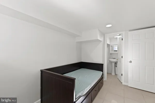 a bedroom with a bed and cabinets