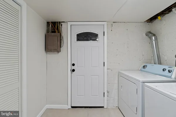 a view of hallway with washer and dryer