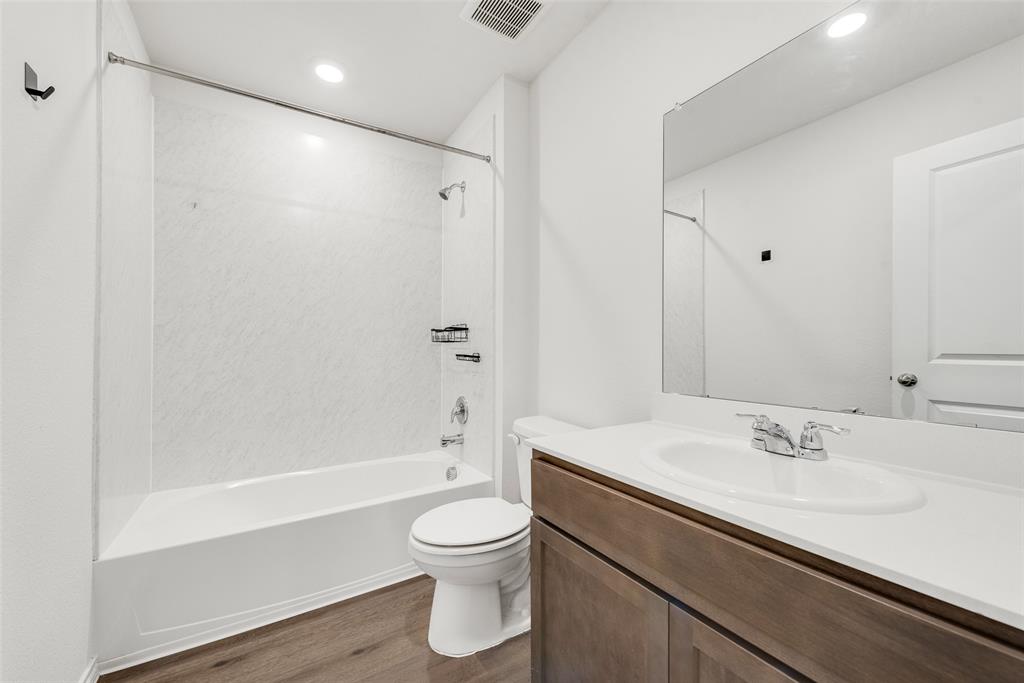623 Sweet Dream Way Lavon, TX 75166 - Photo 15 of 21 a bathroom with a sink a toilet and shower