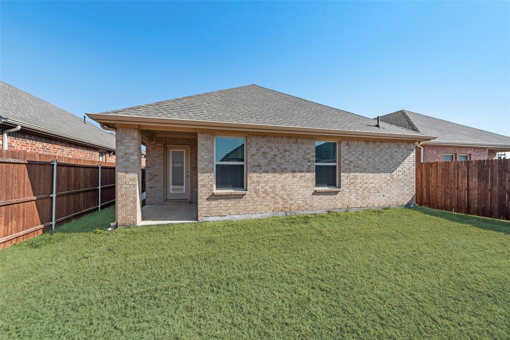 623 Sweet Dream Way Lavon, TX 75166 - Photo 19 of 21 a front view of a house with a yard