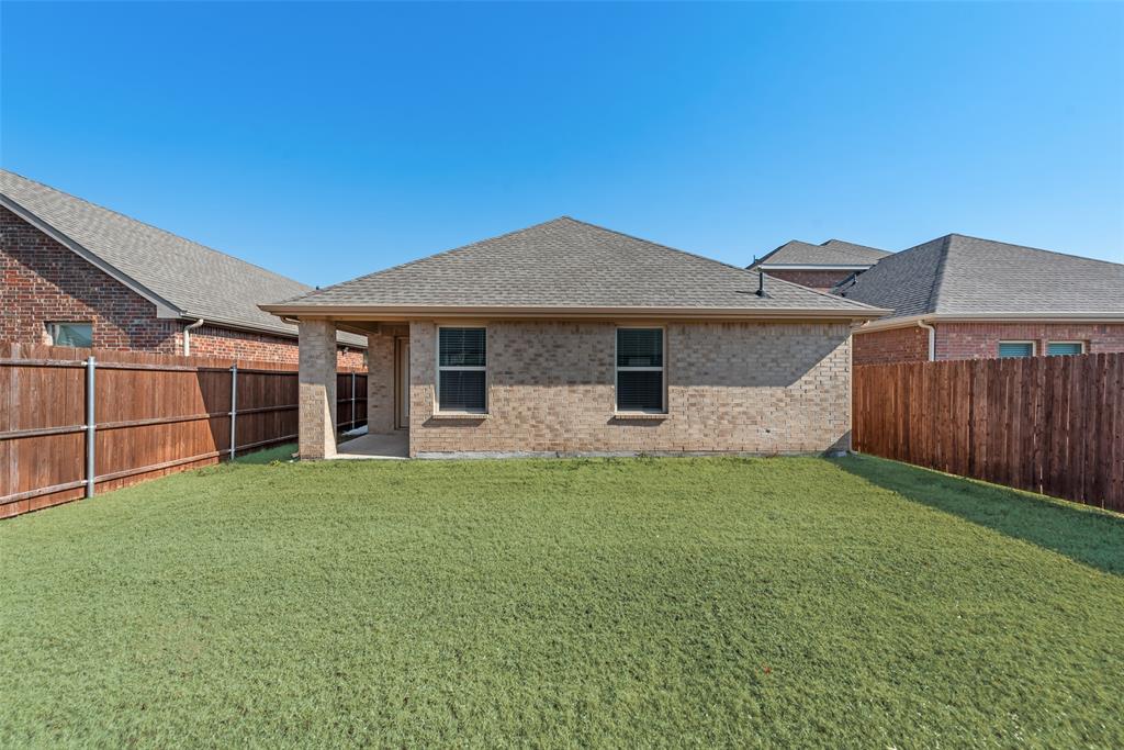 623 Sweet Dream Way Lavon, TX 75166 - Photo 20 of 21 a front view of a house with garden