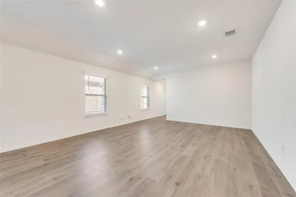 a view of kitchen and a sink with wooden floor