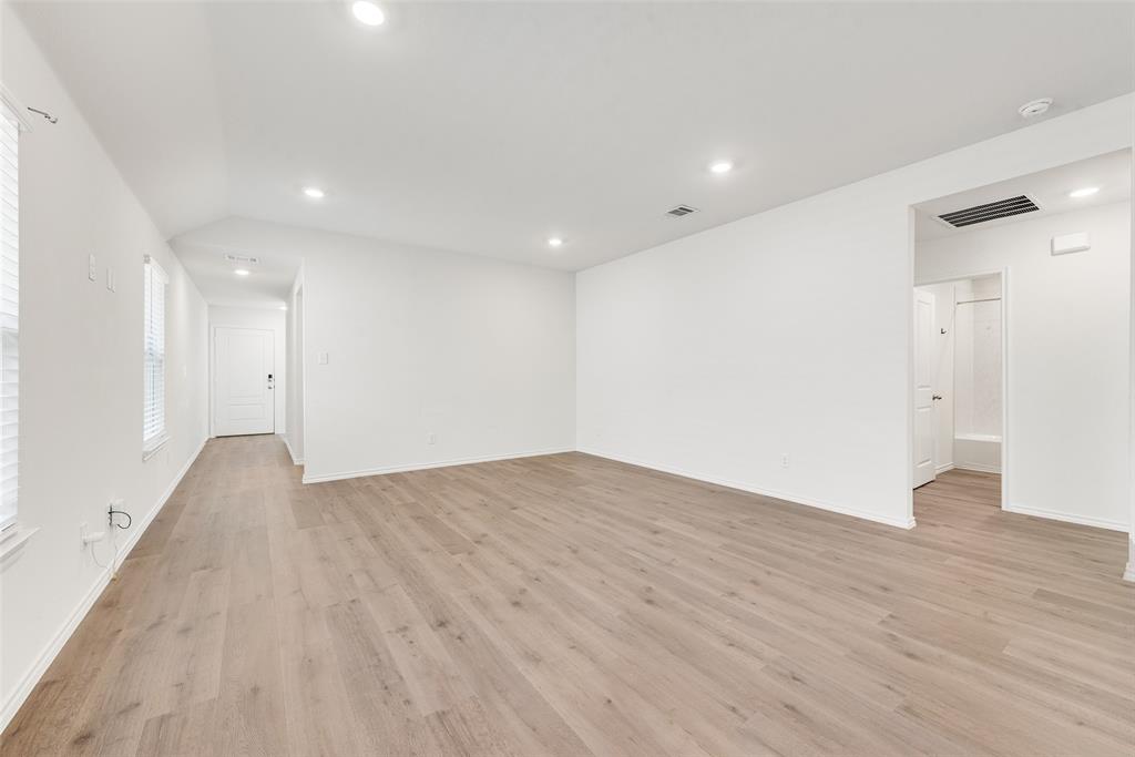 623 Sweet Dream Way Lavon, TX 75166 - Photo 9 of 21 a view of an empty room with wooden floor