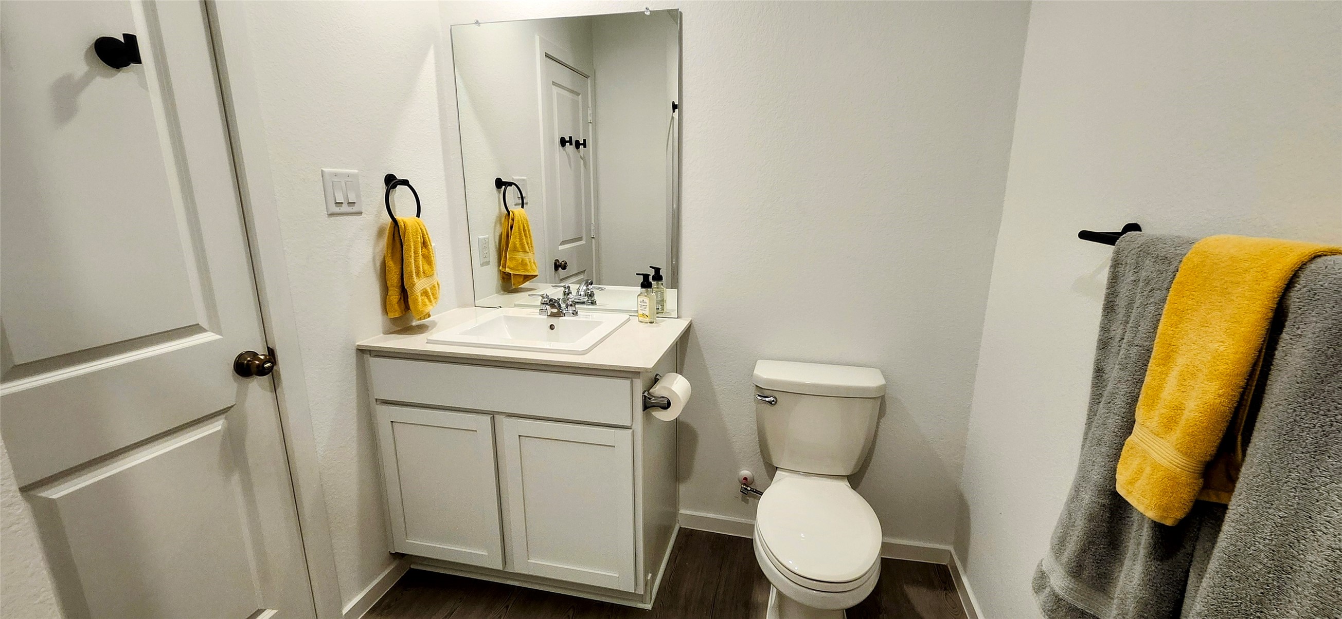 10288 Prairie Dunes Lane Cleveland, TX 77327 - Photo 14 of 15 a bathroom with a toilet sink and mirror