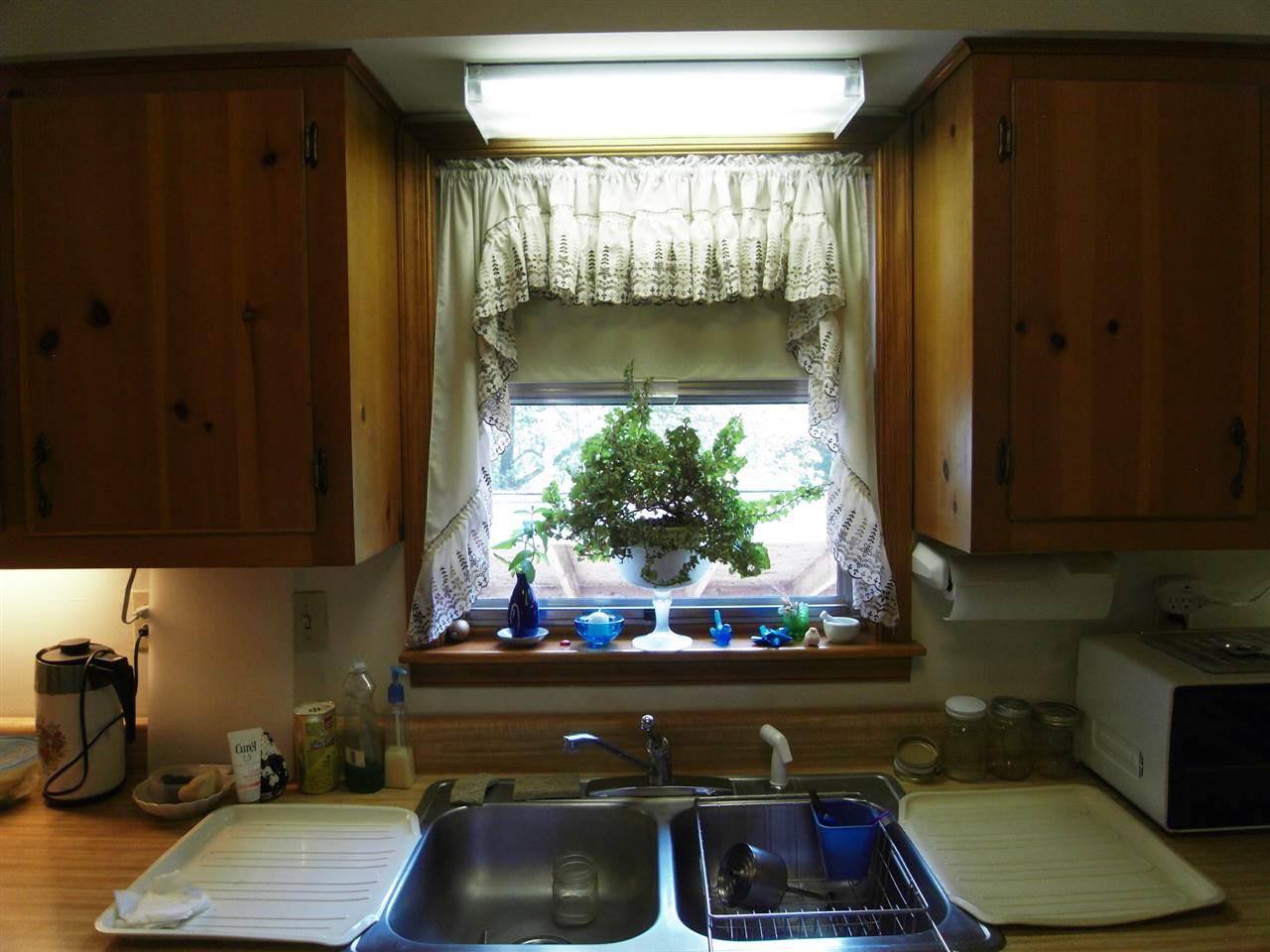 146 Fairview Road Louisa, VA 23093 - Photo 17 of 26 a kitchen with a sink and a stove next to a window