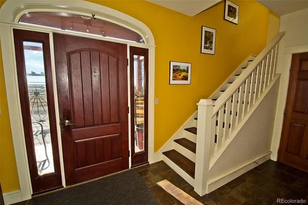 a view of front door with stairs
